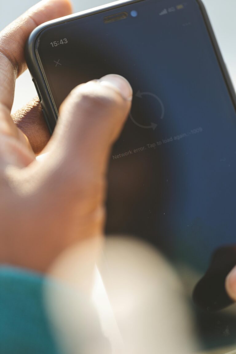 A person uses a smartphone, highlighting touch interaction and screen focus.